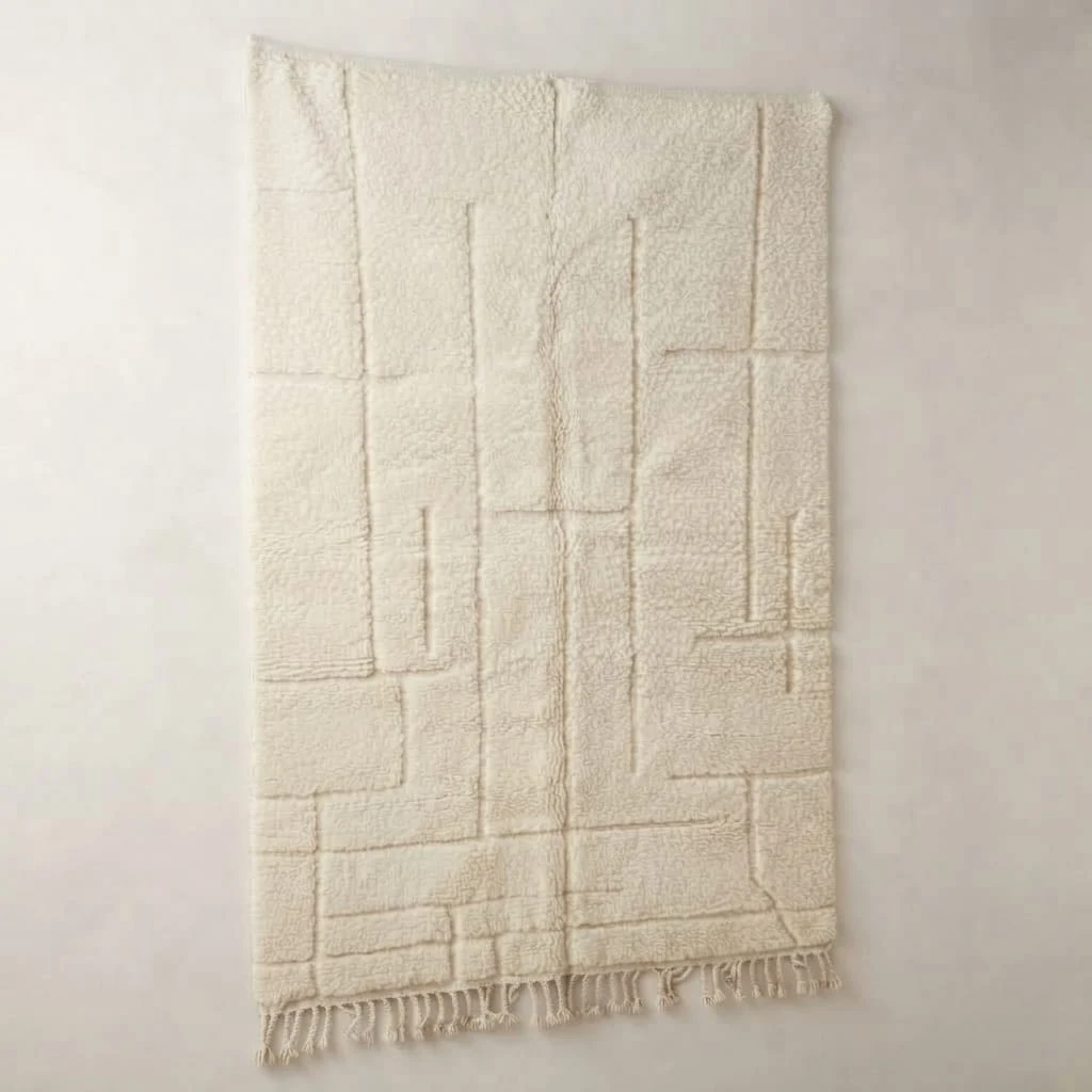 Relief de l’Atlas cream wool rug with a raised geometric pattern